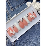 Super pretty fake nails with bows