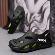 HOKA ONE ONE Hole Shoes รองเท้าแตะอเนกประสงค์อินเทรนด์สําหรับการเดินทางเพื่อการพักผ่อนของผู้ชายรองเท