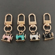 เกาหลีใหม่ DIY เครื่องประดับ ทองน้ำมัน Alloy จุดเล็กๆ รูปเครื่องเย็บผ้า จุกโซ่พวงกุญแจสุนัข. พวงกุญแ