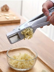 1入組手動大蒜榨汁器廚房工具，用於切碎大蒜、薑等等。