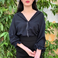 Shirt with cuffed sleeves