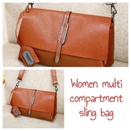 Women multi compartment sling bag