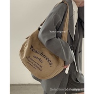 2025 New Khaki Korean Style Canvas Bag Female Student Letter Retro Messenger Bag Versatile Large Cap