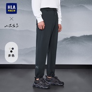 กางเกงวอร์มลำลองชาย HLA ฤดูใบไม้ผลิและฤดูใบไม้ร่วง กางเกงขายาวทรงตรงเอวยางยืด ทรงหลวม ผ้าโพลีเอสเตอร