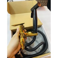 Gold Colour Two Way Tap With Black Colour Bidet Spray And Hose
