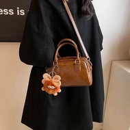 High quality glossy PU leather women's handbag with vintage boxy shape, comes with a cute stuffed an