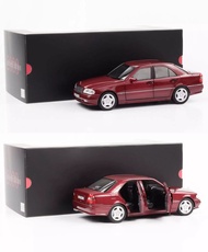 Diecast Mercedes-Benz C36 AMG (W202) 1993-1997 almandine red 1/18 by Norev Dealer box