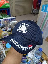 topi security biru