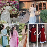 Modern ao dai with round neck, loose shape, embroidered with flowers, 4 panels, mixed with colored p