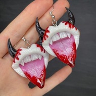 Earrings. Vampire lips with fangs and bloody drops.