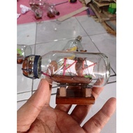 Miniature pinisi ship in the bottle of ship inside the bottle of a bottle of ship size s