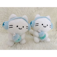 Cute cat teddy bear wearing headphones