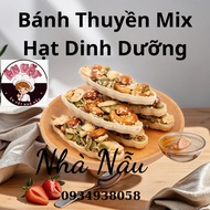 Boat cake mixed with nutritious nuts, safe healthy food, cashews, macadamia nuts, almonds. snacks