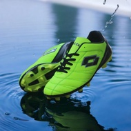 Lotto black green football boots are stitched all around