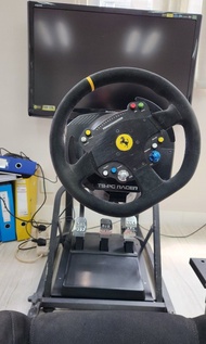 thrustmaster tspc ferrari wheel and racing rig.  not fanatec logitech playseat t300 g923 next level racing simagic