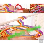 The colorful candy colored plastic rainbow clothes hanger clothes rack clothes hanger hanger hanger