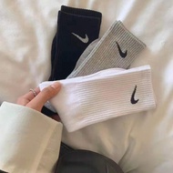 Poppy Nike socks Korean version socks women's and men's long tube black and white medium tube sports
