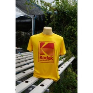 A013 เสื้อยืดคอกลม สกรีนลาย "Kodak" สีสด งานคมชัด ซักไม่หลุด สีไม่ตก มี4ไซส์ M,L,XL,2XL