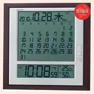 Seiko clock, wall clock, and table clock hybrid, with a flip calendar, radio wave function, digital display of the six days, temperature, and humidity, in a tea metallic finish. SQ421B SEIKO