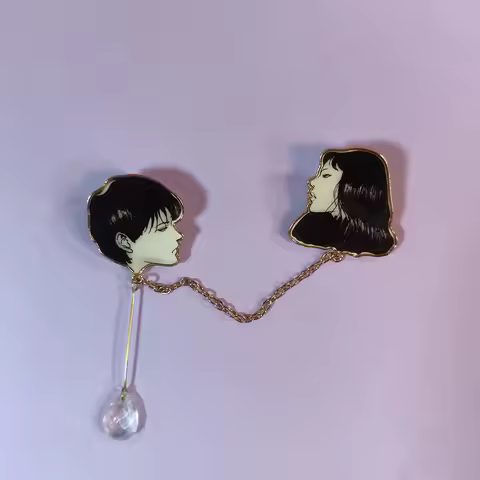 This elegant enamel pin is inspired by Tomie from Junji Ito's works. With fine craftsmanship, it sho