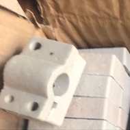 Ceramic base for heating bulb