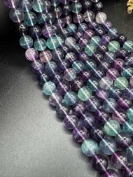 Natural fluorite (rainbow) in plain round shape beads (1 strand=17inch) size 68 and 10 MM.