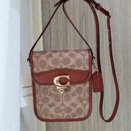 กระเป๋าสะพายข้าง  กระเป๋าใส่โทรศัพท์มือถือ Coach Shop Tall Studio Crossbody In Signature Canvas C8484