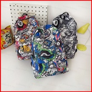 PDF3 Graffiti Comic Backpack Lightweight and Versatile Student Trendy Commuting Schoolbag