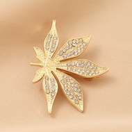 Golden maple leaf brooch