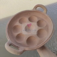 Traditional terracotta banh khot mold with 8 cakes