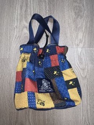 limited edition Peanuts x FDMTL drawstring bag featuring a patchwork boro-style design.