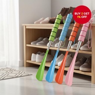 A telescoping shoe horn with a metal handle, adjustable from 29cm to 70cm in length, suitable for al