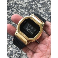 Customised Casio G-Shock DW-5600BB, DW5600BB In Gold Metal Bezel And Original Rubber Strap
