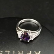 925 Pure Silver Ladies Ring With 7x9mm Purple CZ And Six 1.5mm White CZ Stones.